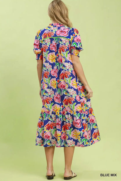 Blue floral print Umgee puff sleeve tiered midi dress with a relaxed fit, perfect for casual or semi-formal occasions.