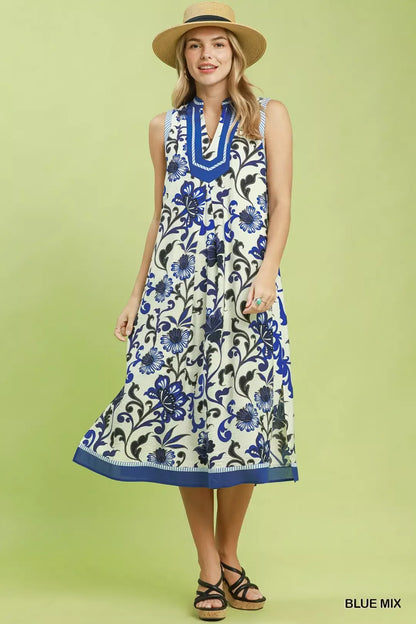 Blue floral scroll sleeveless midi dress by Umgee featuring a flowy design and elegant pattern, perfect for summer or casual occasions.