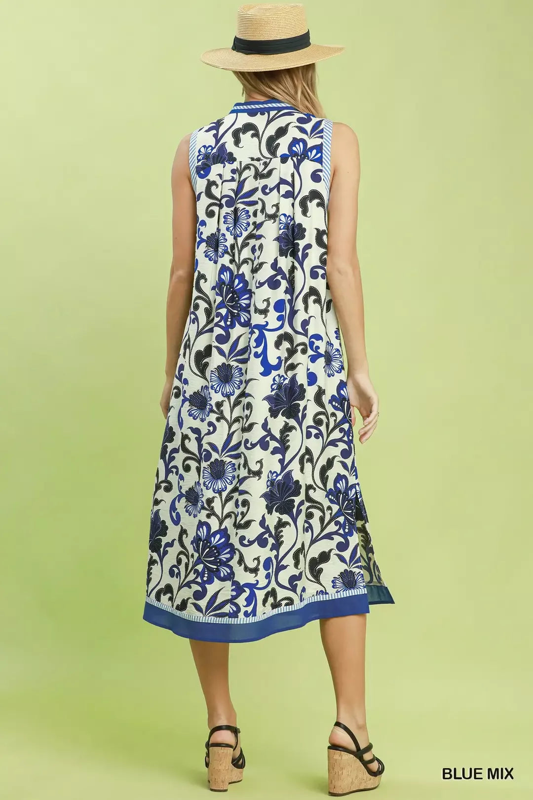Blue floral scroll sleeveless midi dress by Umgee, featuring a flowy silhouette and intricate pattern, perfect for warm weather.