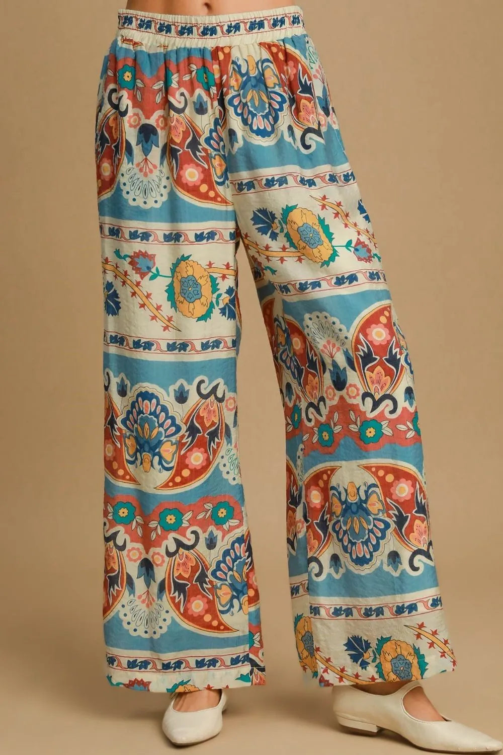 Plus size Umgee wide leg border print pants in blue mix, featuring a comfortable fit and stylish design.