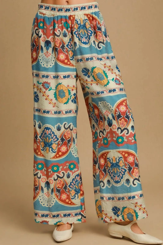 Plus size Umgee wide leg border print pants in blue mix, featuring a comfortable fit and stylish design.