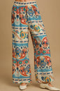 Plus size Umgee wide leg border print pants in blue mix, featuring a comfortable fit and stylish design.