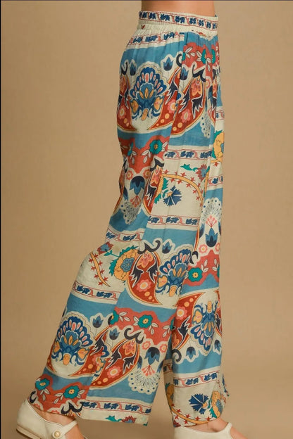 Plus size Umgee wide leg border print pants in blue mix, featuring a relaxed fit and stylish design for casual wear.