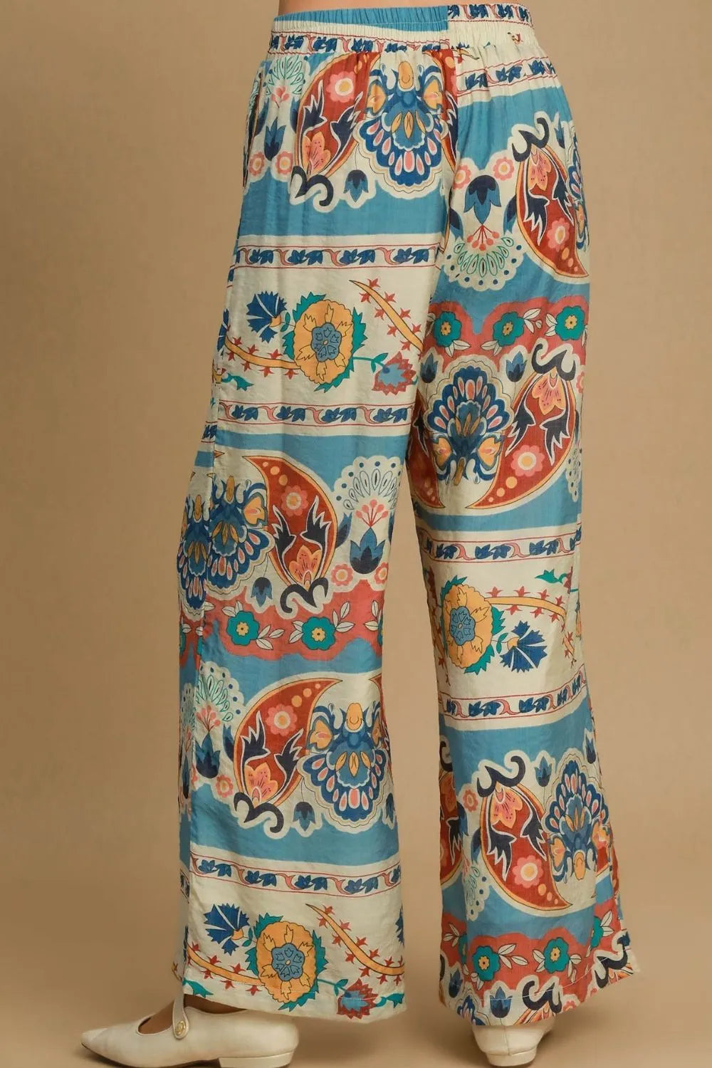 Plus size Umgee wide leg border print pants in blue mix, featuring a relaxed fit and stylish design for comfortable, trendy wear.