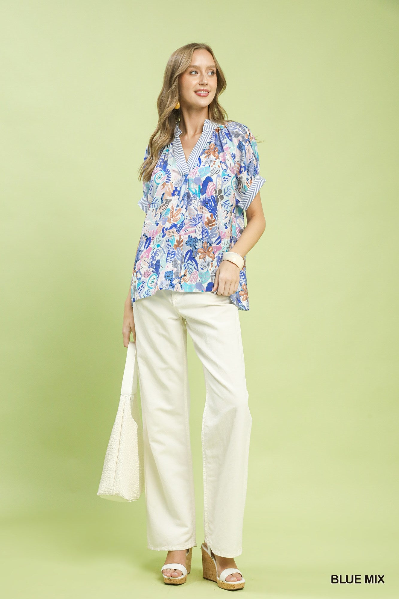 Blue Umgee Mix Boho printed V-neck top with relaxed fit and bohemian style, featuring colorful abstract patterns.