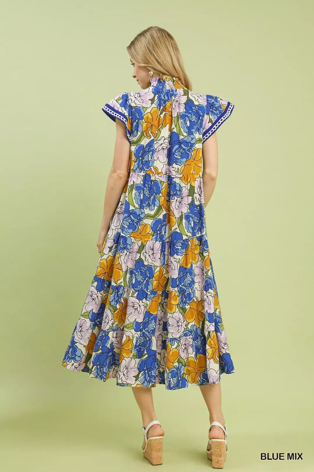 Blue floral tiered midi dress by Umgee featuring bold mixed floral print and flowing silhouette.