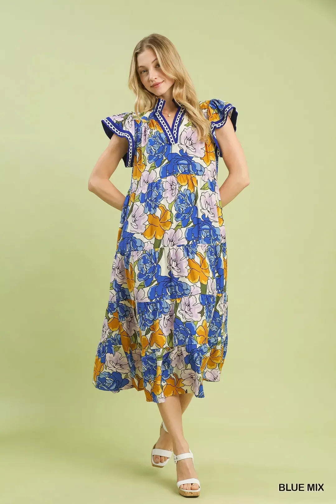 Blue floral tiered midi dress by Umgee with bold mixed floral pattern, perfect for casual or summer wear.