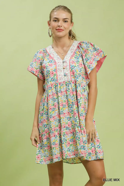 Blue Umgee floral tiered mini dress with side pockets, featuring a mixed floral pattern and lightweight fabric.