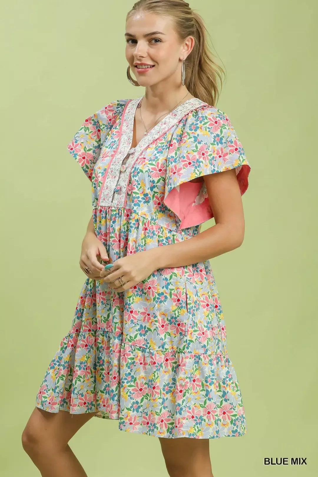 Blue floral tiered mini dress with side pockets by Umgee, featuring a casual, flowy design perfect for warm weather.