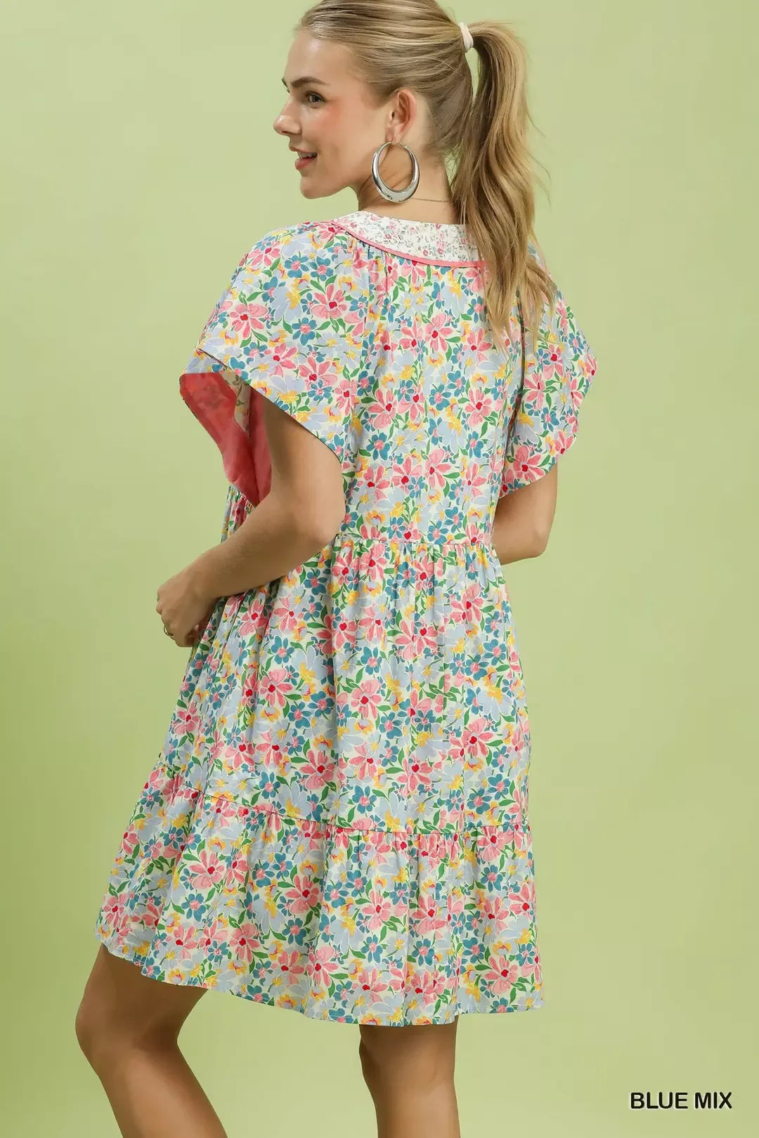 Blue floral tiered mini dress with side pockets by Umgee, featuring a relaxed fit and lightweight fabric for casual wear.