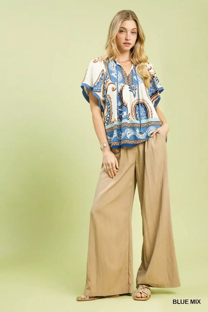 Blue Umgee Mix Paisley Border Print Tassel Top with tassel accents and flowy design, perfect for casual or boho styles.