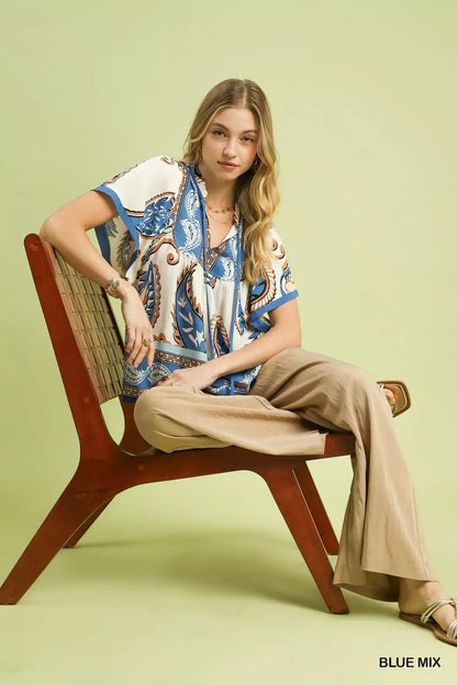 Blue Umgee tassel top with paisley border print, featuring a relaxed fit and stylish design, perfect for casual wear.