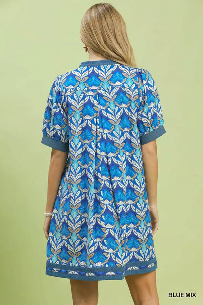 Blue Umgee Mix Tile Print Mini Dress from Trendsi, featuring a stylish pattern and sleeveless design, perfect for casual wear.