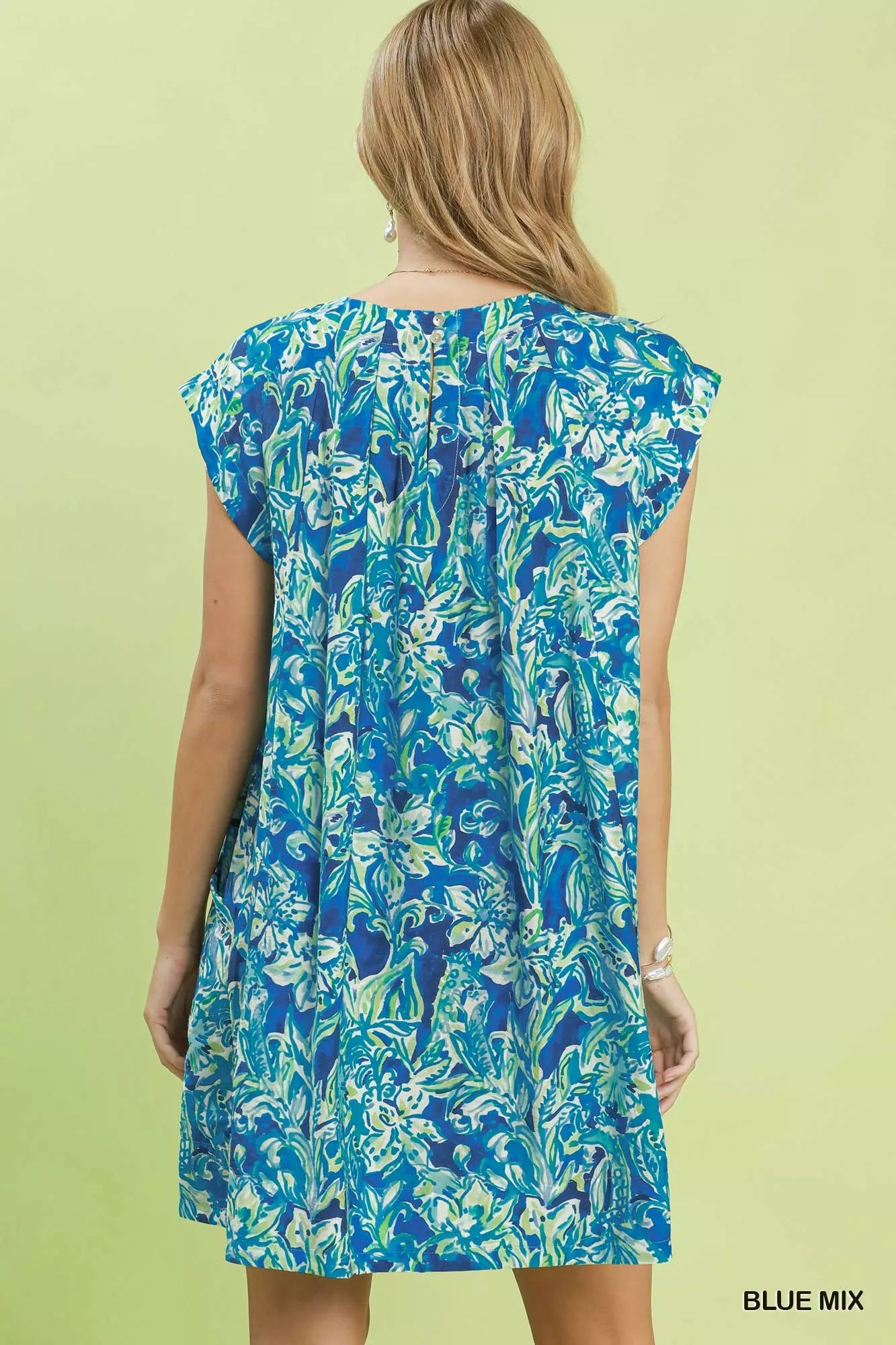 Blue tropical floral flutter sleeve swing dress by Umgee, featuring a relaxed fit and vibrant floral pattern.