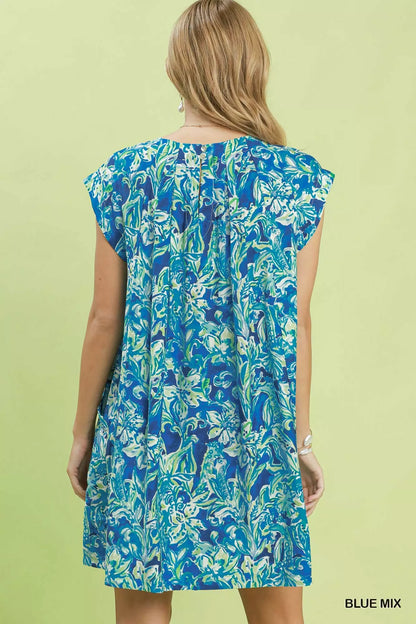 Blue tropical floral flutter sleeve swing dress by Umgee, featuring a relaxed fit and vibrant floral pattern.