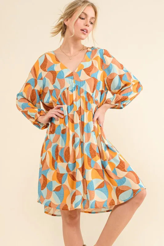 Blue printed open-back casual dress with puff sleeves from Trendsi, featuring a relaxed fit and stylish design.