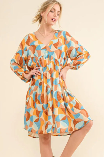 Blue printed open-back casual dress with puff sleeves from Trendsi, featuring a relaxed fit and stylish design.