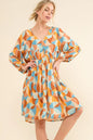 Blue printed open-back casual dress with puff sleeves from Trendsi, featuring a relaxed fit and stylish design.