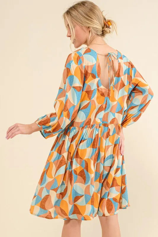 Blue printed open-back casual dress with puff sleeves from Trendsi, featuring a relaxed fit and stylish design.