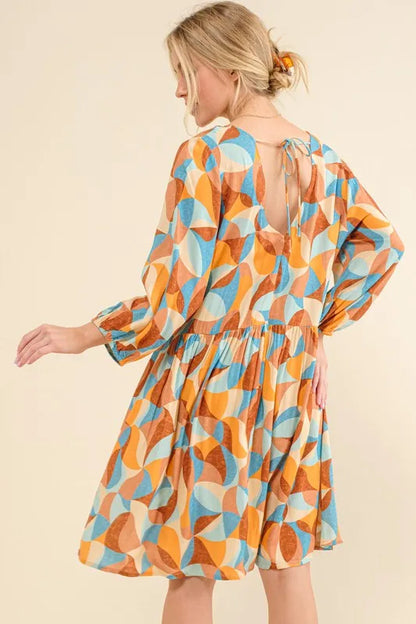 Blue printed open-back casual dress with puff sleeves from Trendsi, featuring a relaxed fit and stylish design.
