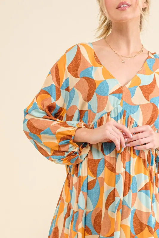 Blue multi-colored printed casual dress with open back and puff sleeves, by Trendsi, perfect for relaxed, stylish wear.