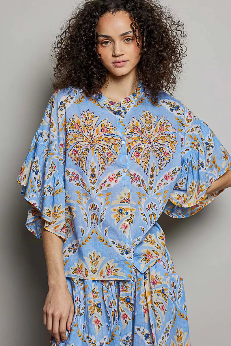 Blue multi-color floral printed woven ruffle sleeve shirt from Trendsi with a relaxed fit and stylish design.