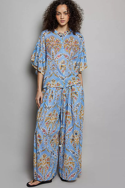 Blue multi floral printed woven ruffle sleeve shirt from Trendsi with a relaxed fit and stylish design.