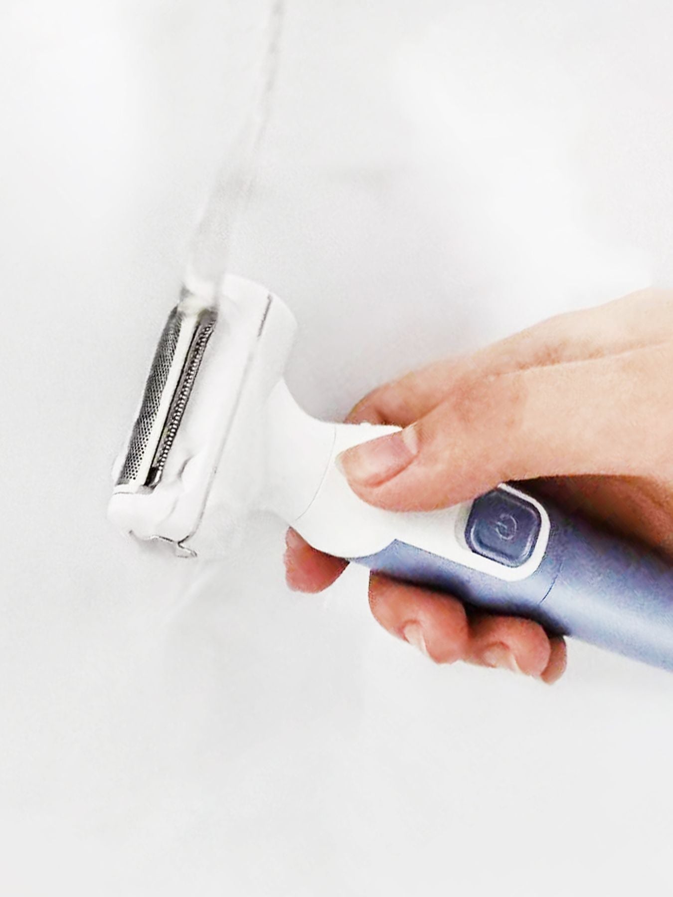 Blue and purple Trendsi painless hair removal epilator with ergonomic design for efficient, gentle hair removal.