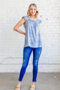 Blue boho print ruffle baby doll tank top by Trendsi, featuring a relaxed fit and feminine ruffle details.