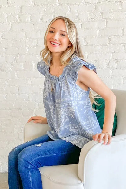 Blue boho print ruffle baby doll tank top by Trendsi featuring a relaxed fit and feminine ruffle details.