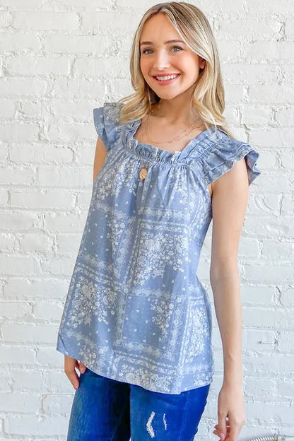 Blue boho print ruffle baby doll tank top by Trendsi featuring a relaxed fit and feminine ruffle details.