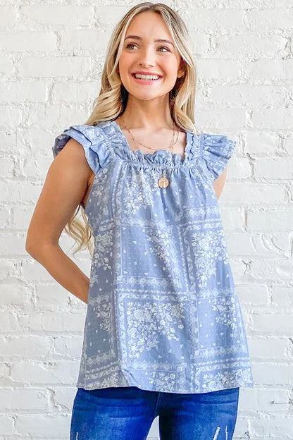 Blue boho print ruffle baby doll tank top by Trendsi, featuring a relaxed fit and stylish ruffle details.