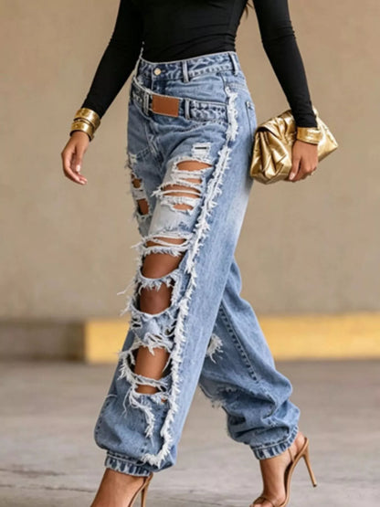 Blue distressed loose fit jeans from Trendsi, showcasing rugged denim with a relaxed, casual style and frayed detailing.