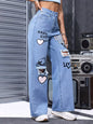 Blue distressed printed wide-leg jeans from Trendsi featuring a relaxed fit and trendy design.