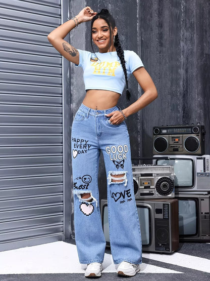 Blue distressed printed wide-leg jeans by Trendsi, showing a relaxed fit with ripped details and bold printed design.
