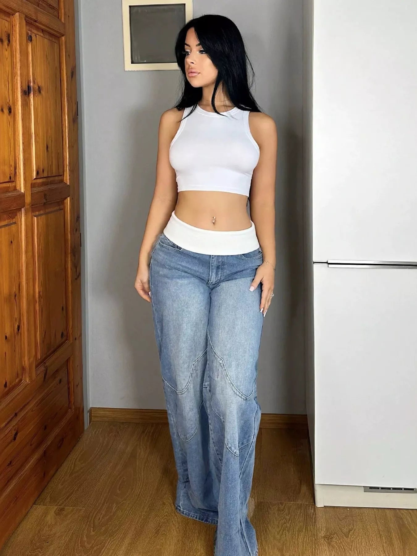 Blue Trendsi folded-over waistband wide-leg jeans folded neatly, showcasing relaxed fit and stylish design.