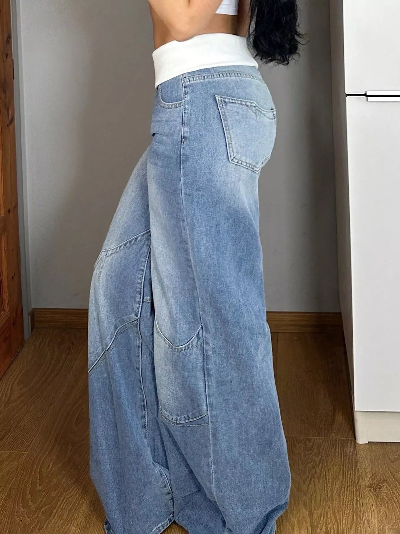 Blue Trendsi fold-over waistband wide-leg jeans, neatly folded to showcase relaxed fit and stylish design.