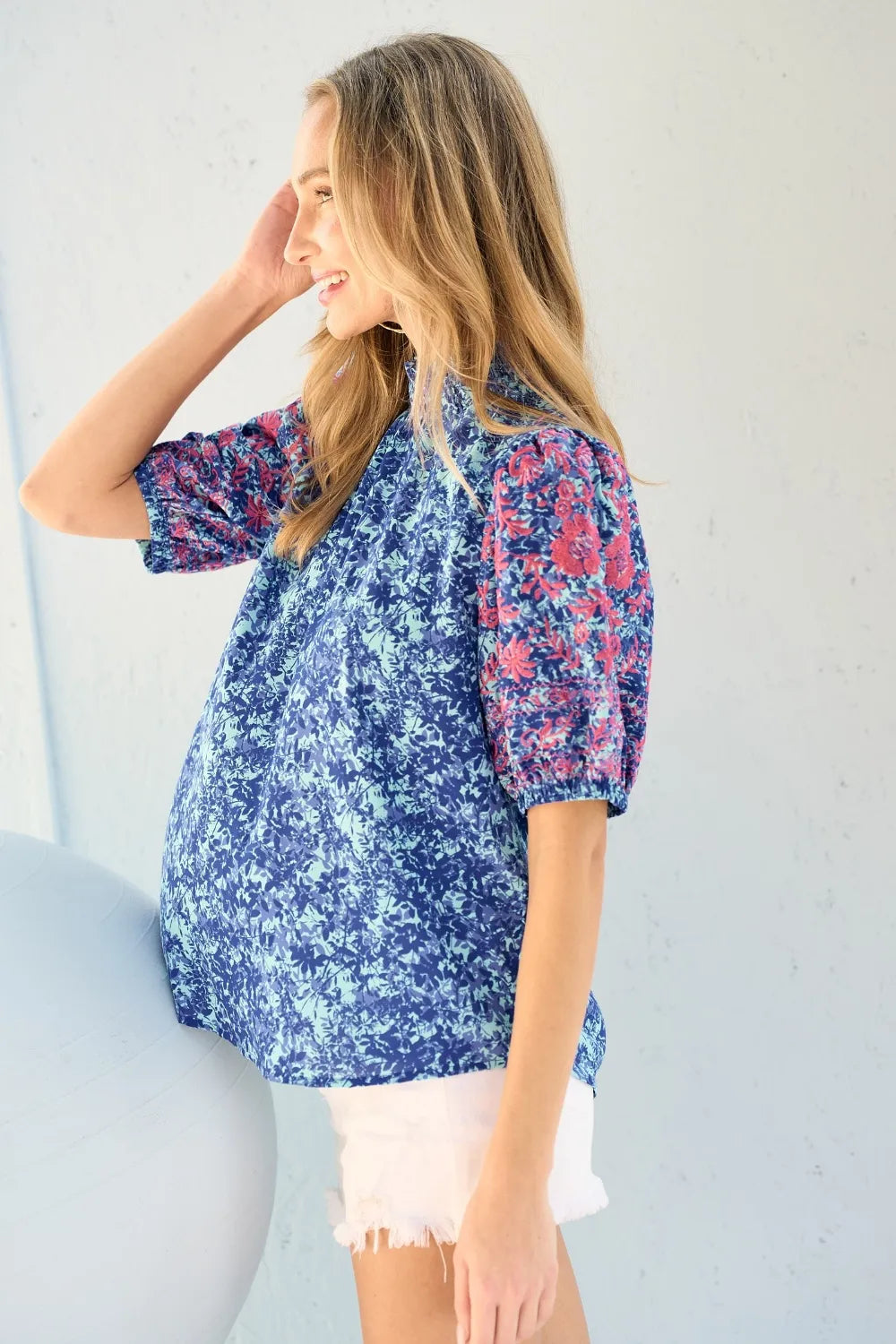 Blue Hailey & Co embroidered puff sleeve printed blouse by Trendsi with floral embroidery and stylish puff sleeves.