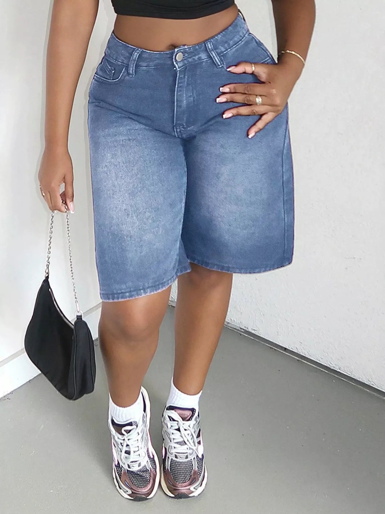 Blue high-waisted wide-leg denim shorts by Trendsi, featuring a casual fit and classic denim texture.