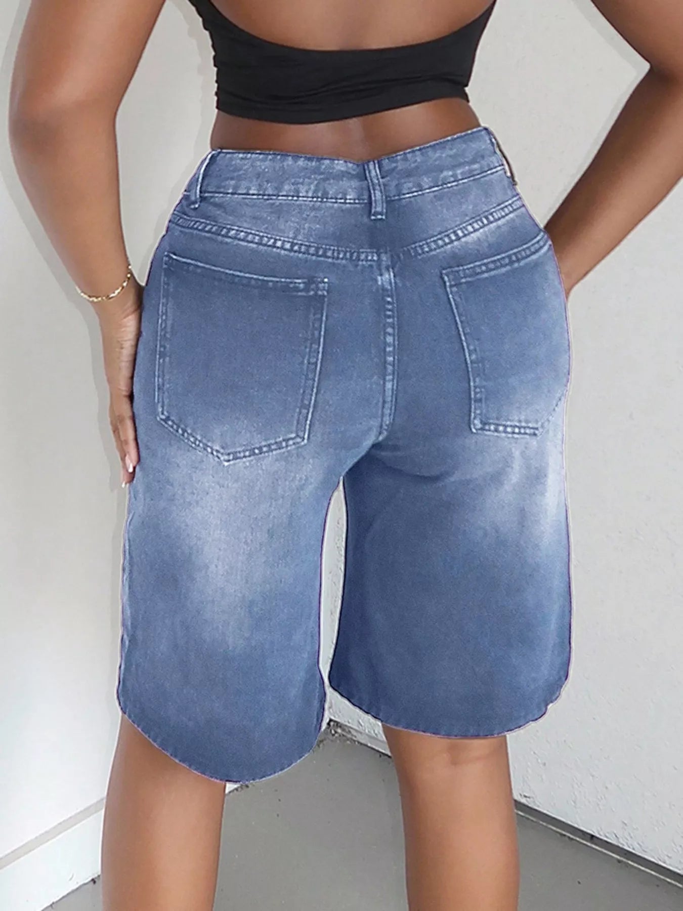 Blue high-waisted wide-leg denim shorts from Trendsi, featuring a relaxed fit and classic denim texture.