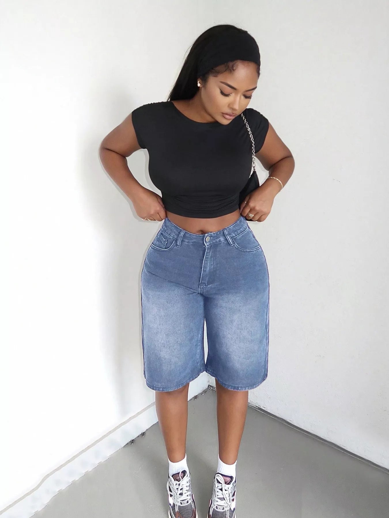 Blue high-waisted wide-leg denim shorts by Trendsi, featuring a relaxed fit and classic denim texture.