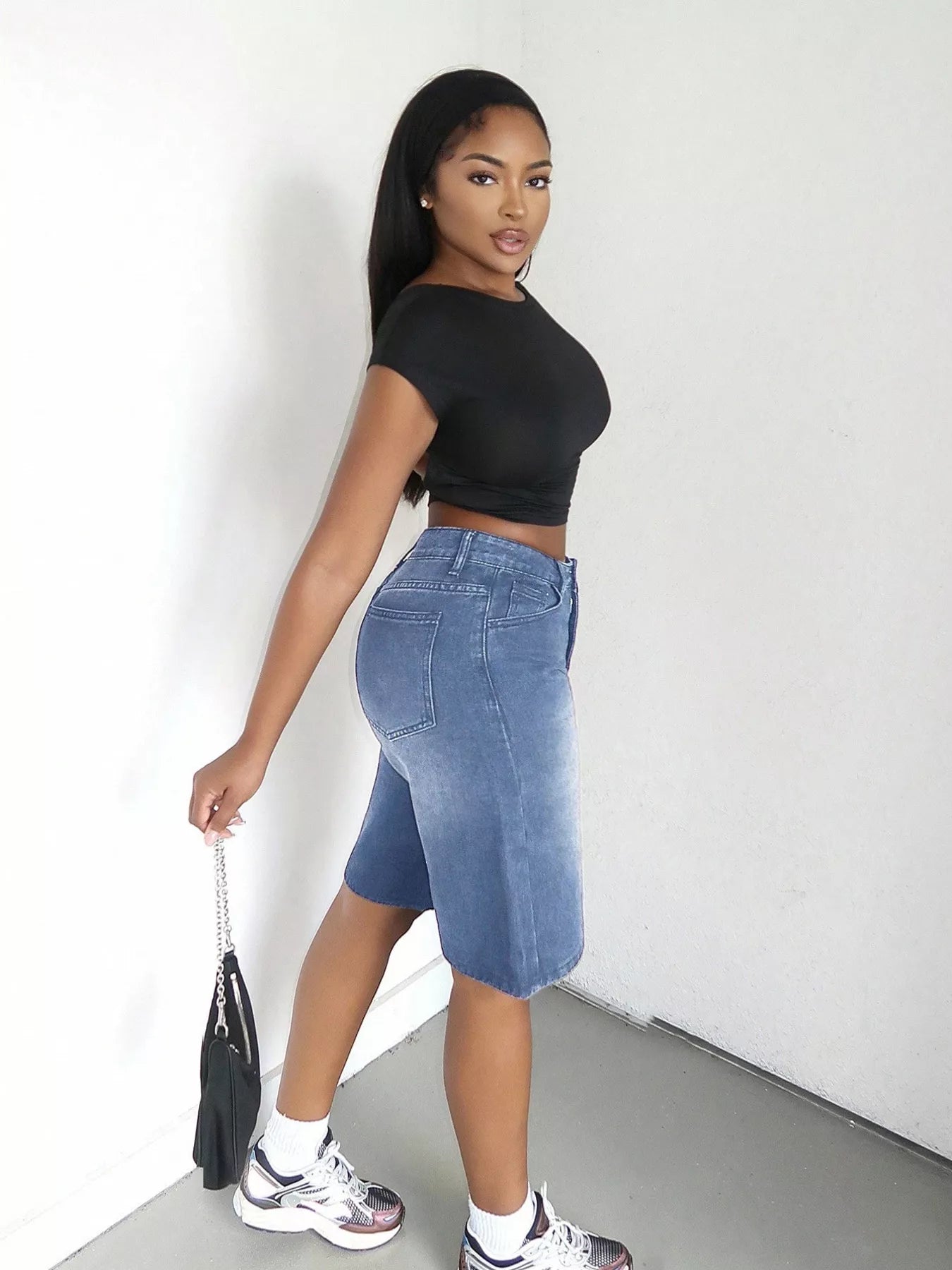 Blue high-waisted wide-leg denim shorts from Trendsi, featuring a relaxed fit and classic denim texture.