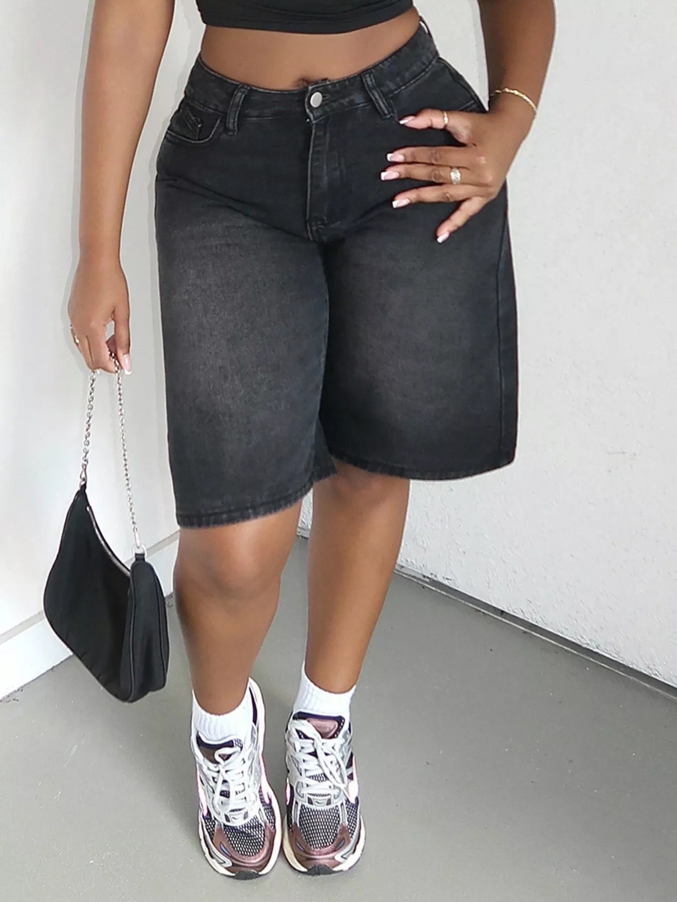 Blue high-waisted wide-leg denim shorts by Trendsi, showing the relaxed fit and stylish design on a model.