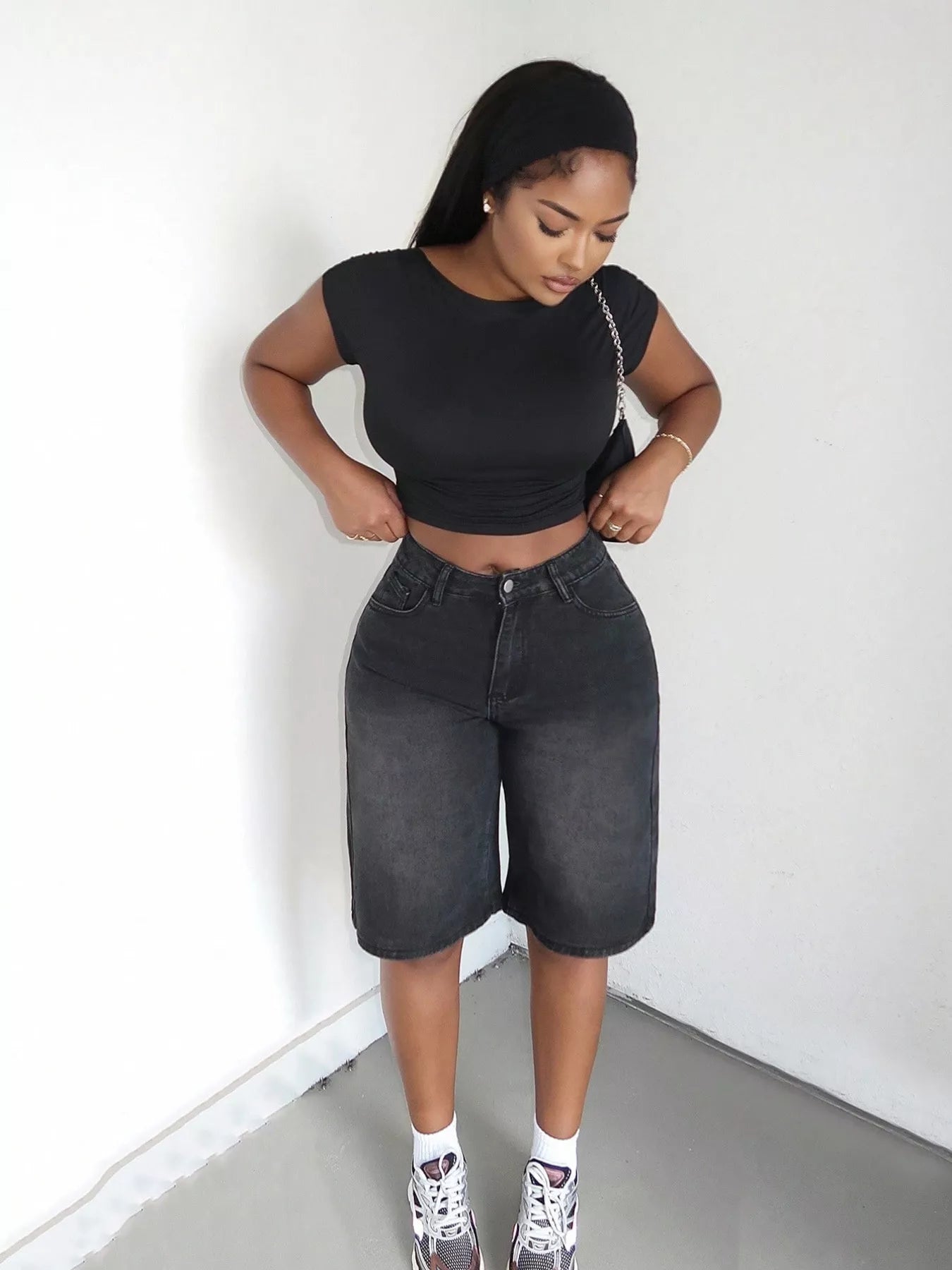 Blue high-waisted wide-leg denim shorts from Trendsi, showing the relaxed fit and stylish design on a model.