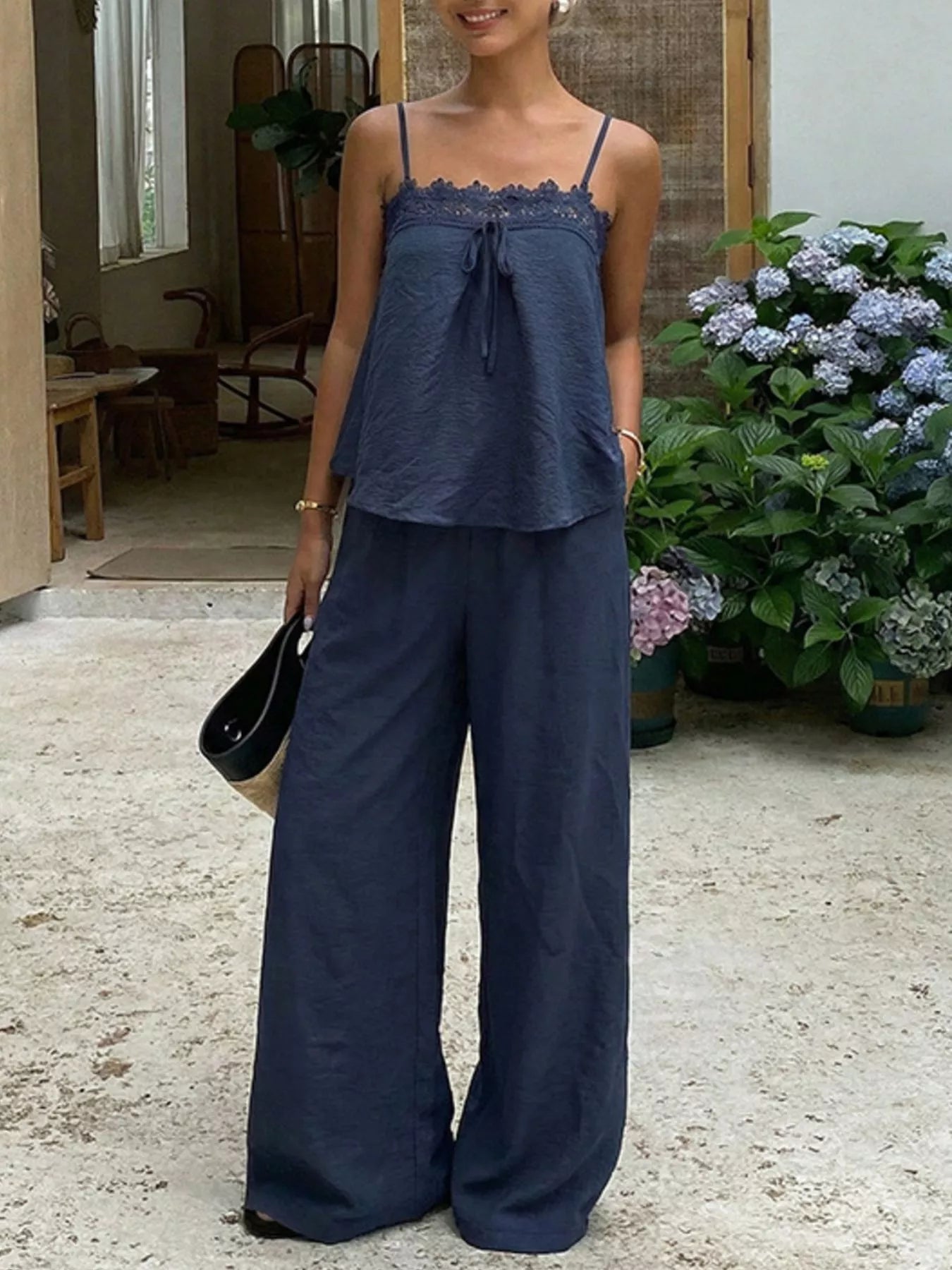 Blue lace trim cami and wide-leg pants set by Trendsi, featuring a stylish sleeveless top and flowing trousers.