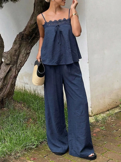 Blue lace trim cami and wide-leg pants set by Trendsi, featuring a stylish sleeveless top and flowy trousers.
