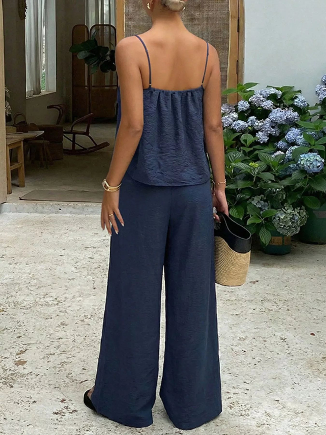 Blue lace trim cami and wide-leg pants set by Trendsi, featuring a stylish sleeveless top and flowy trousers.