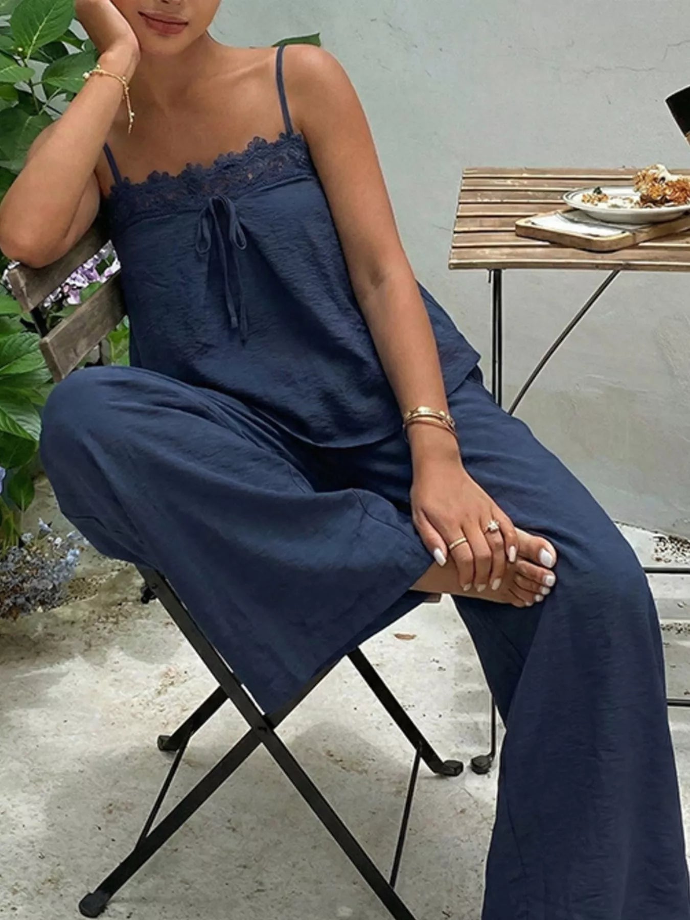 Blue lace trim cami and wide-leg pants set by Trendsi, featuring a stylish sleeveless top and flowy, comfortable pants.