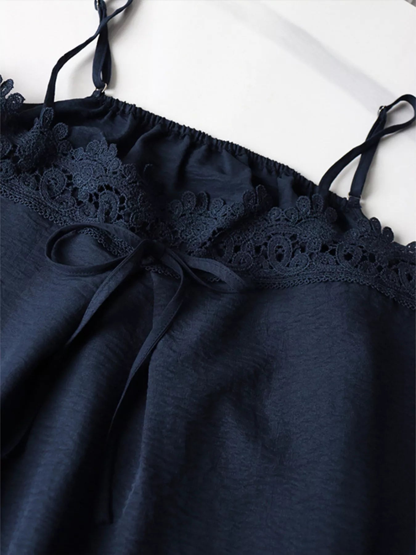 Blue lace trim cami and wide-leg pants set by Trendsi, featuring a stylish sleeveless top and flowy trousers.