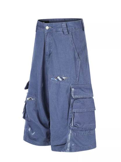 Men's distressed cargo capris in blue by Trendsi, featuring a casual fit with distressed details and multiple cargo pockets.
